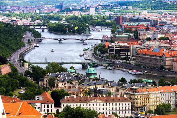 Scenic view of Finland showcasing vast forests, serene lakes, and modern Nordic architecture, reflecting the country’s natural beauty and high quality of life.
