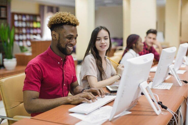Students in a modern classroom or lecture hall with multilingual materials..jpg